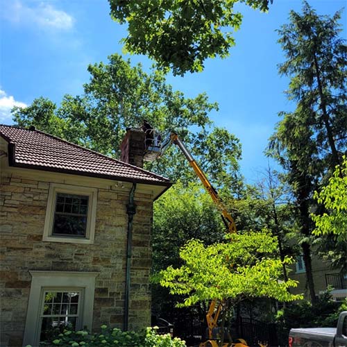 Chimney Reline with Technician in crane