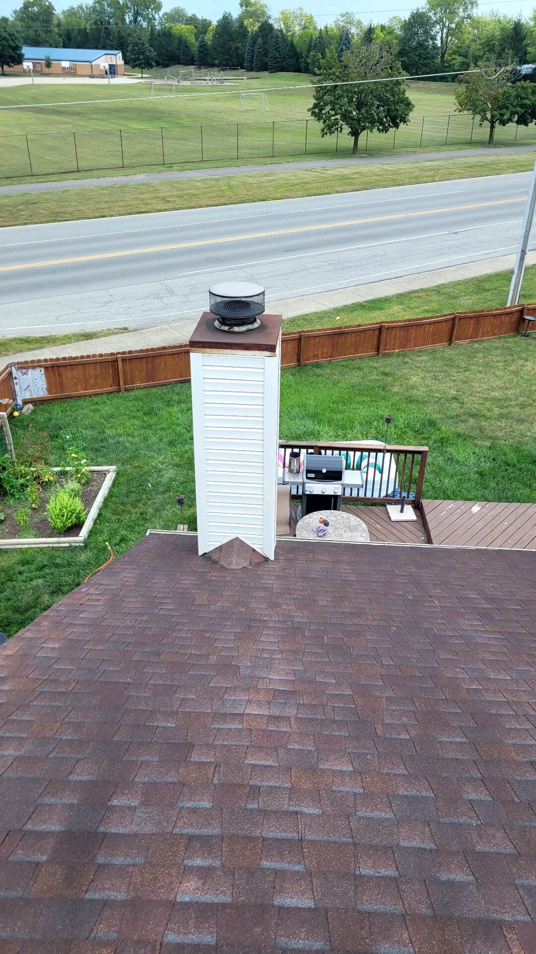 original photo of a white chimney chase with chimney cap