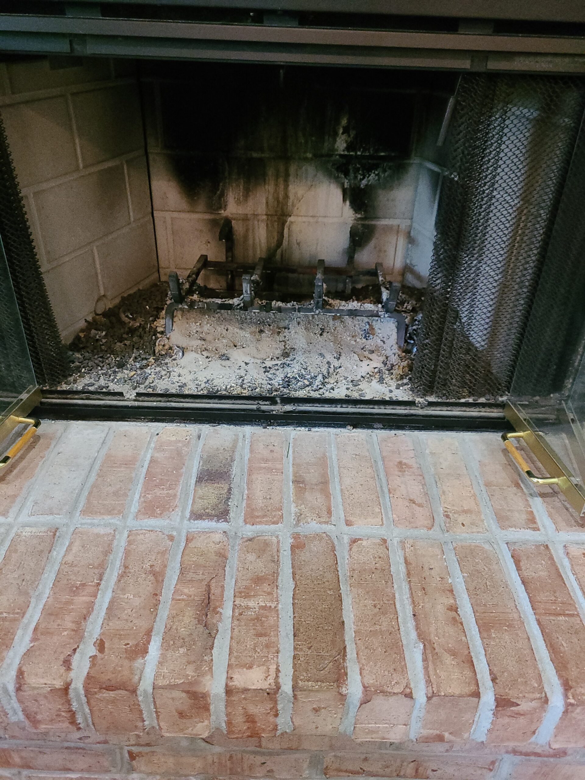 Original image by Beck's Chimney showing firebox filled with ash.