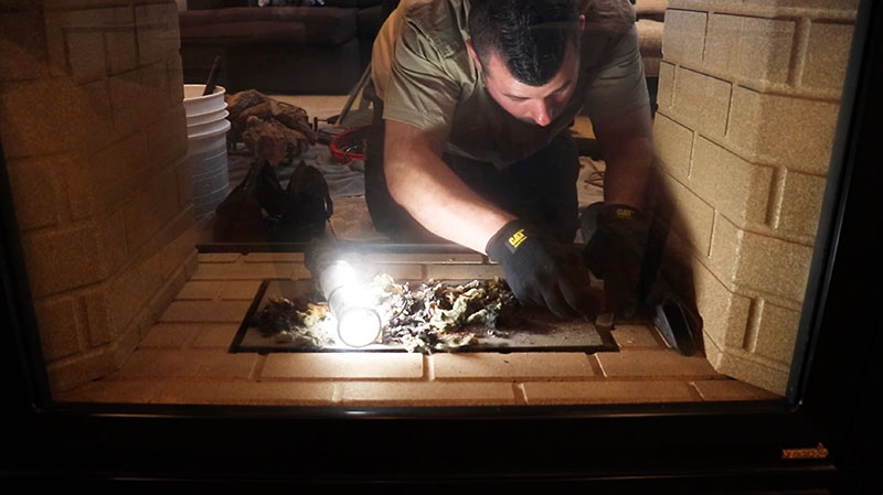 Technician serving gas fireplace